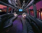 Chauffeur driven Party Bus limousine hire interior in UK