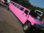 Chauffeur stretched pink Hummer H2 limo hire in Bristol, Gloucester, Cheltenham, Cardiff, Wales, Weston Super Mare, and Bath.